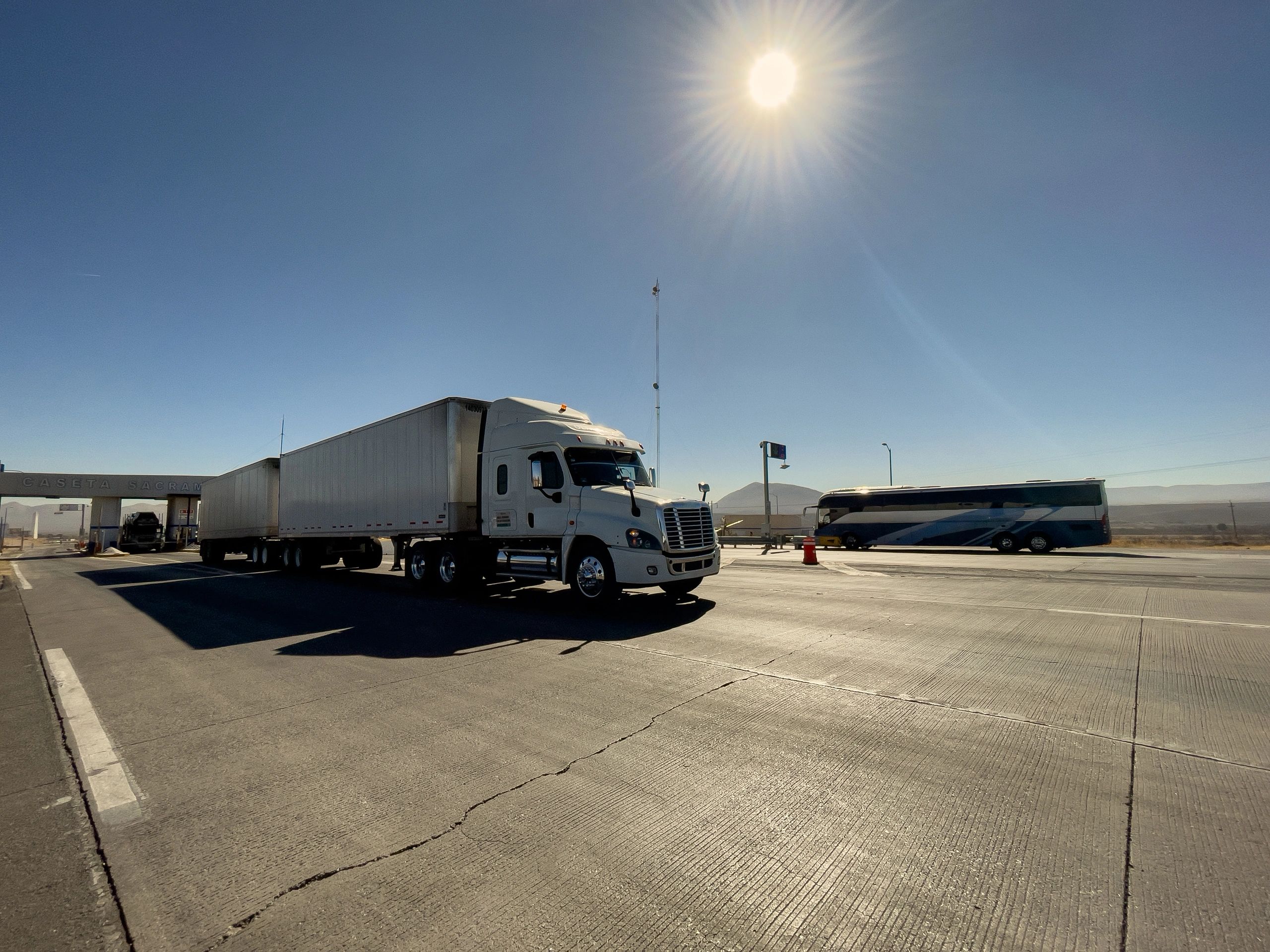 Semi-truck with double trailer on a transport route